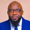 A portait photo of Andre Toussaint.