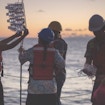 scientists retrieving water samples