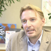 A screenshot of Andrea Alù talking.