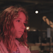Photo of a young girl in red light.